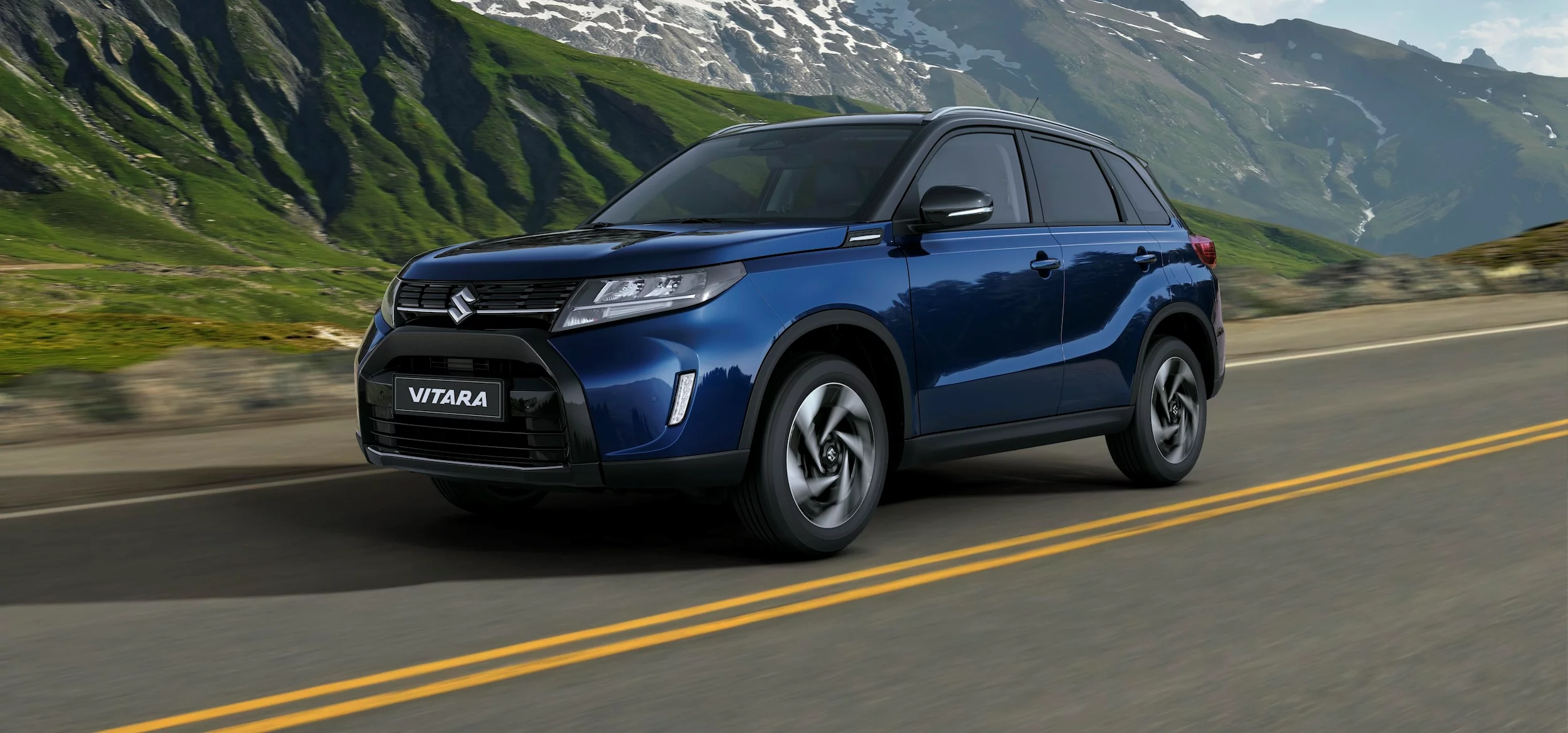 Sphere Blue Suzuki Vitara driving along the coast