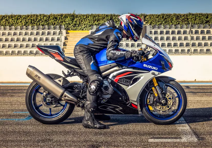 Suzuki GSX-R1000R right hand side shot with rider, about to begin a race on the grid.