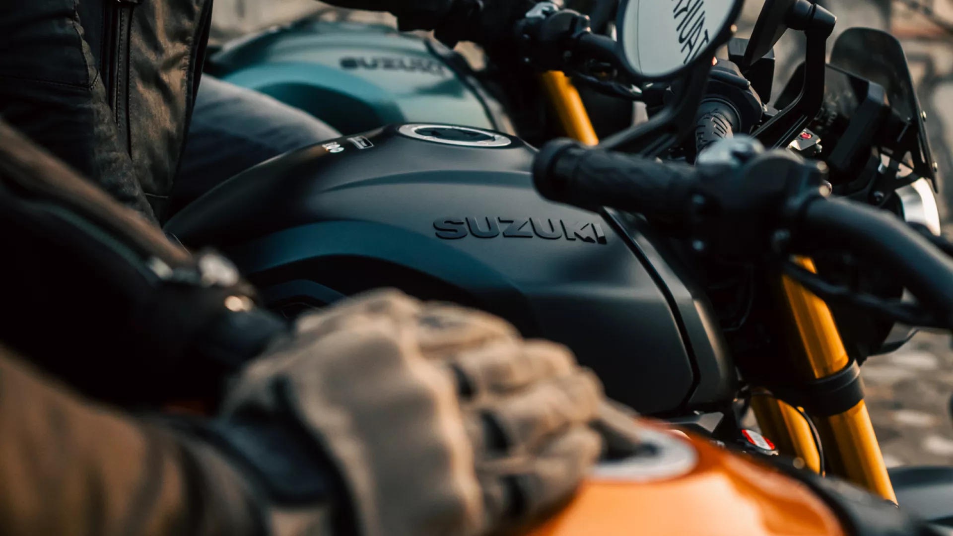 Suzuki GSX-8T three bikes in a line looking across the fuel tanks.