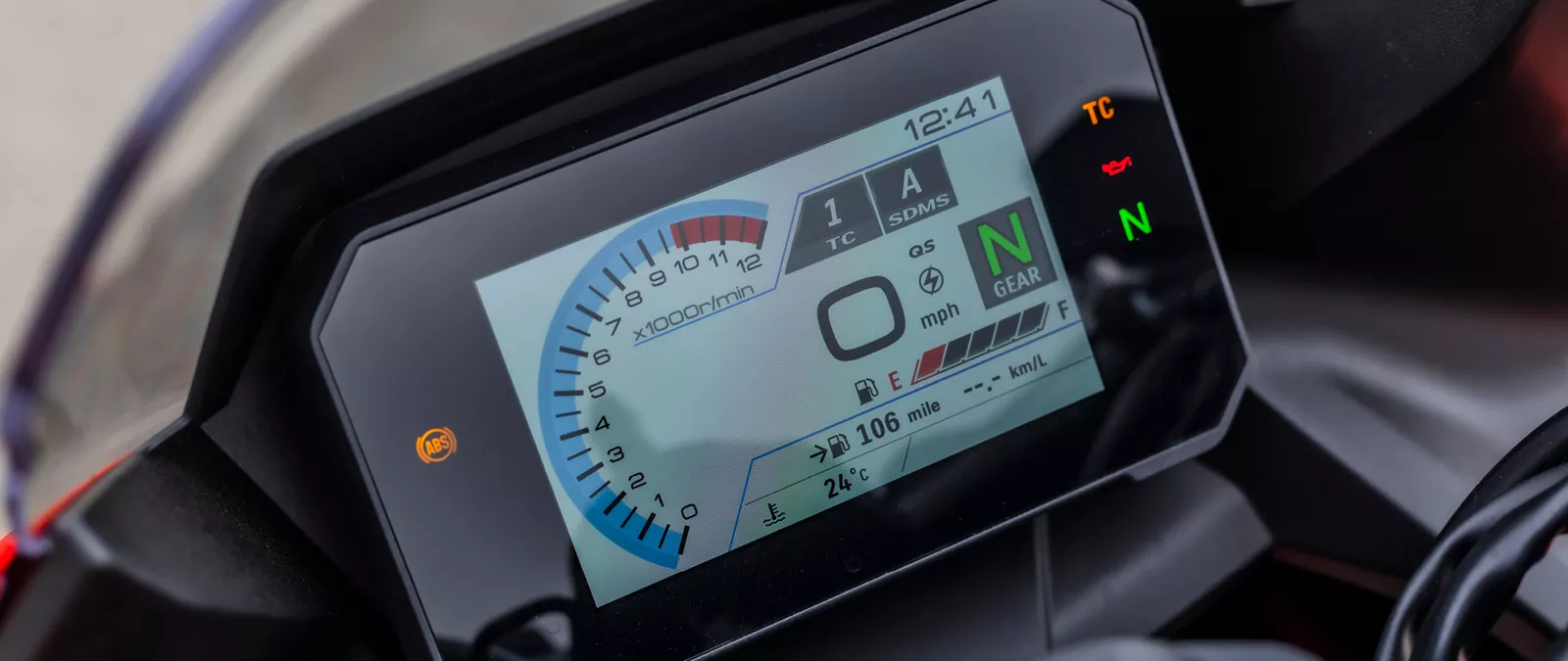 Suzuki GSX-8R orange TFT dash close-up on location