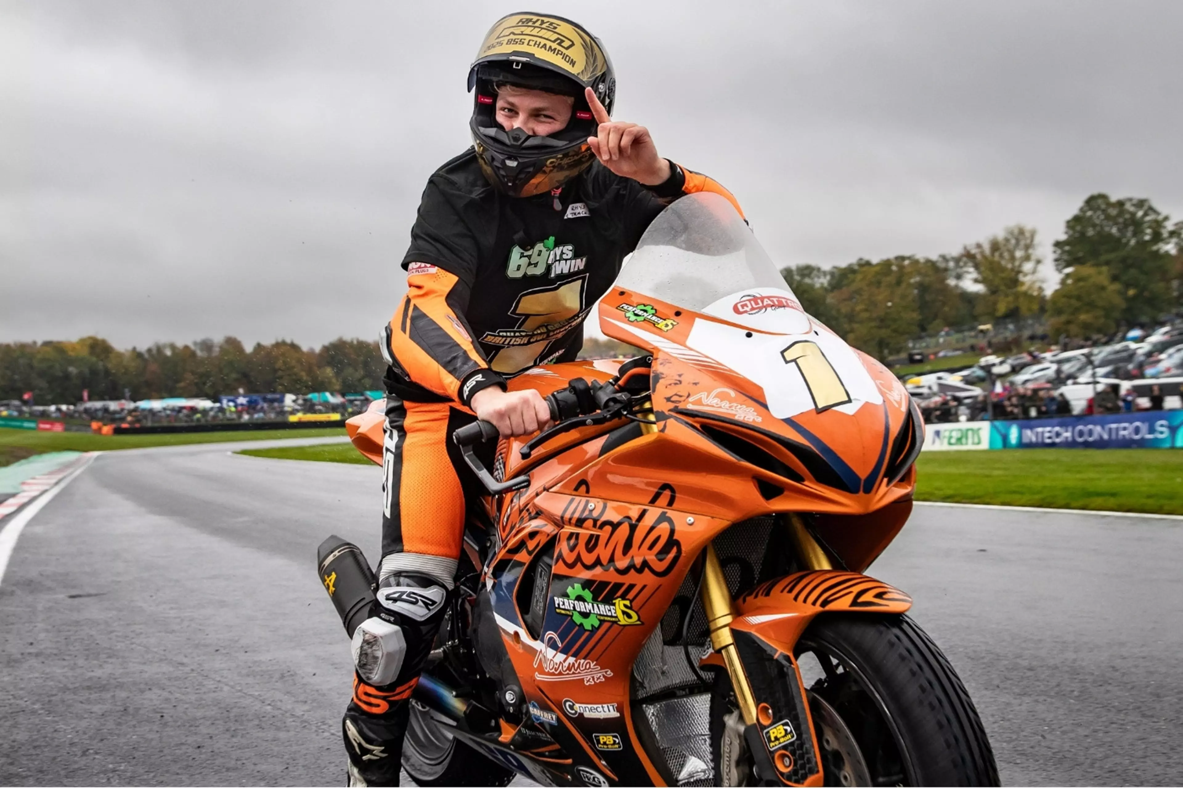 Rhys Irwin celebrate winning the supersport title on his GSX-R750