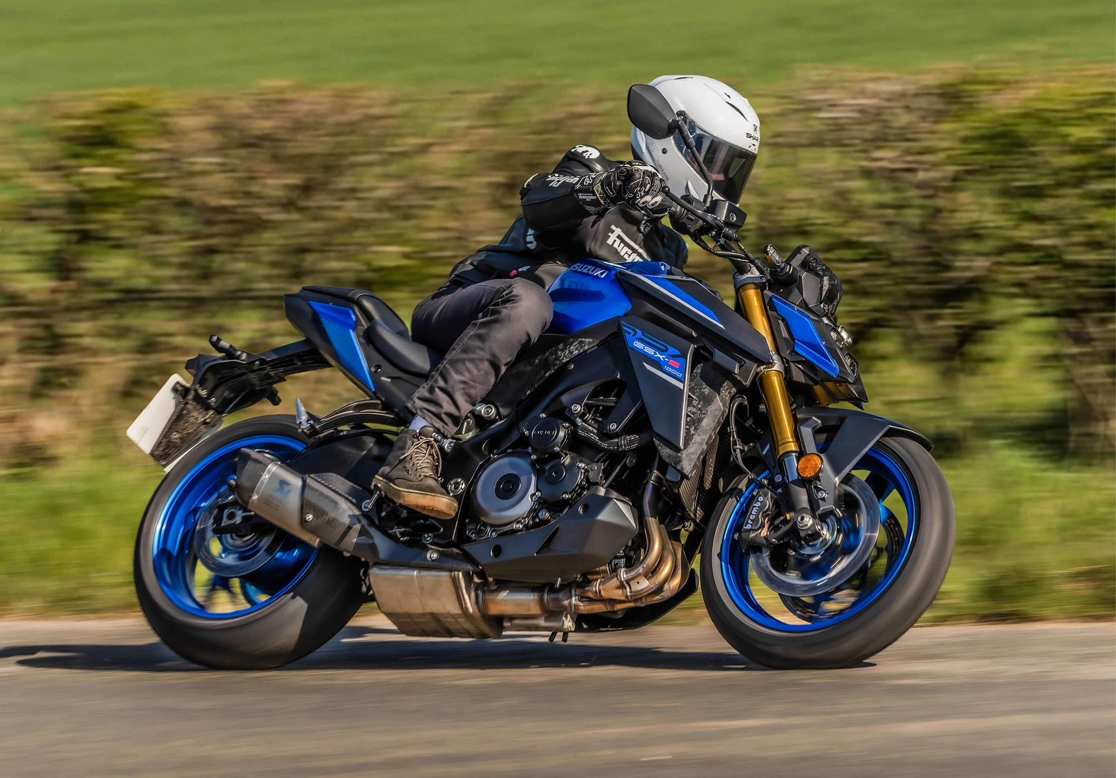 Suzuki GSX-S1000 on a country road.
