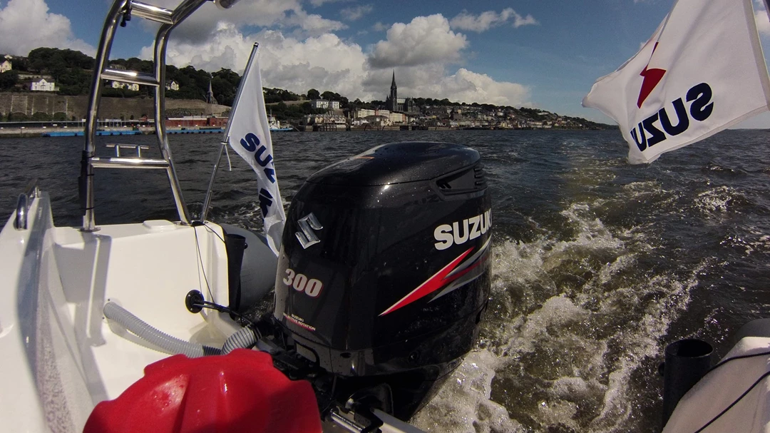 Suzuki outboard and flags on a boat