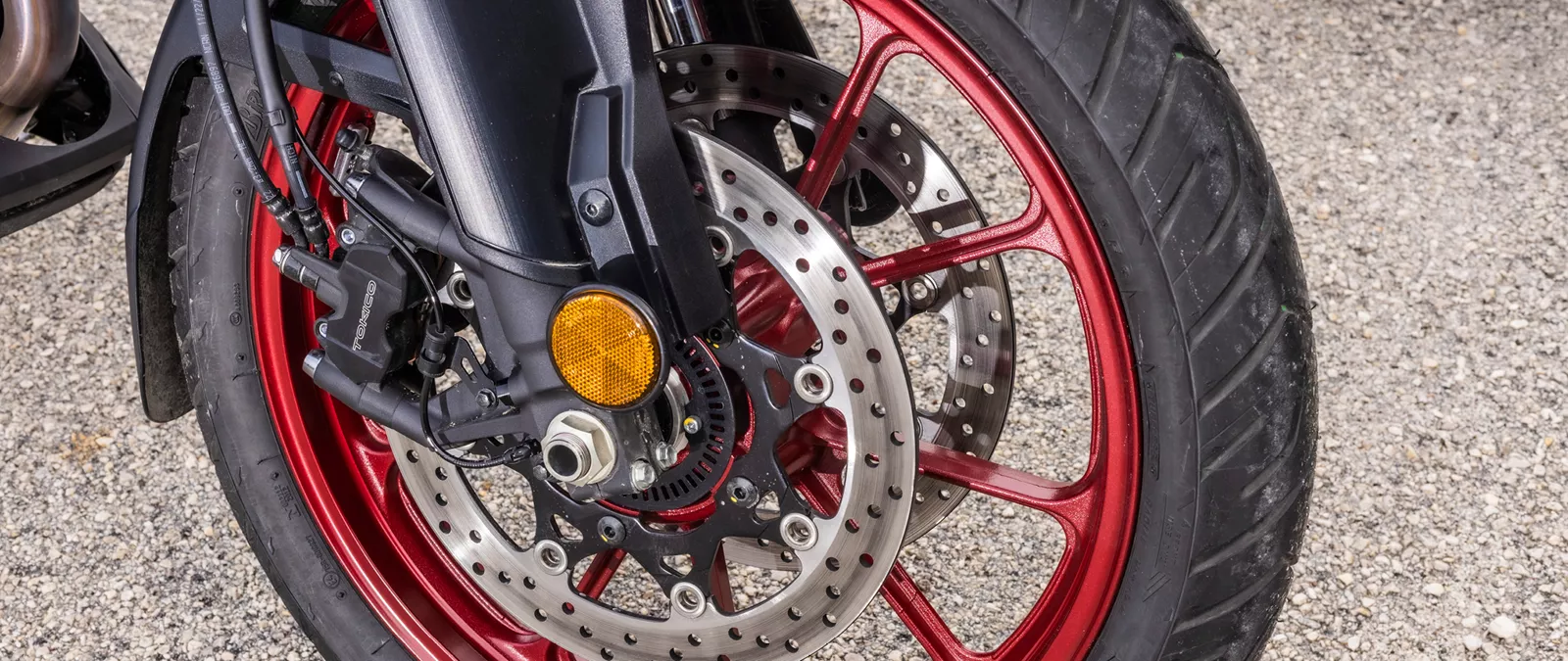 Suzuki V-Strom 1050RE front wheel and brake close-up