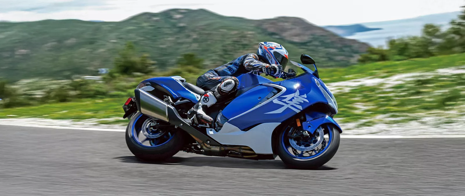 Suzuki Hayabusa Special Edition leaning hard into a corner on a mountain road