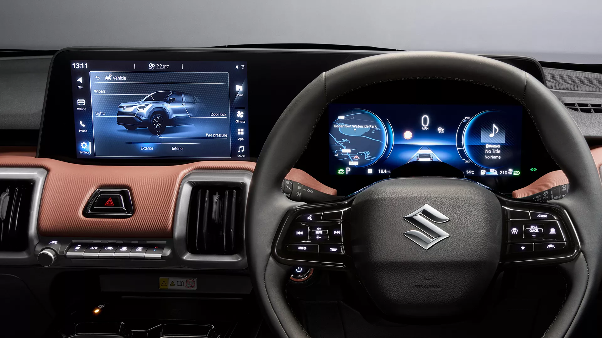 Suzuki e Vitara’s integrated display system, showing the touchscreen infotainment panel and digital driver display