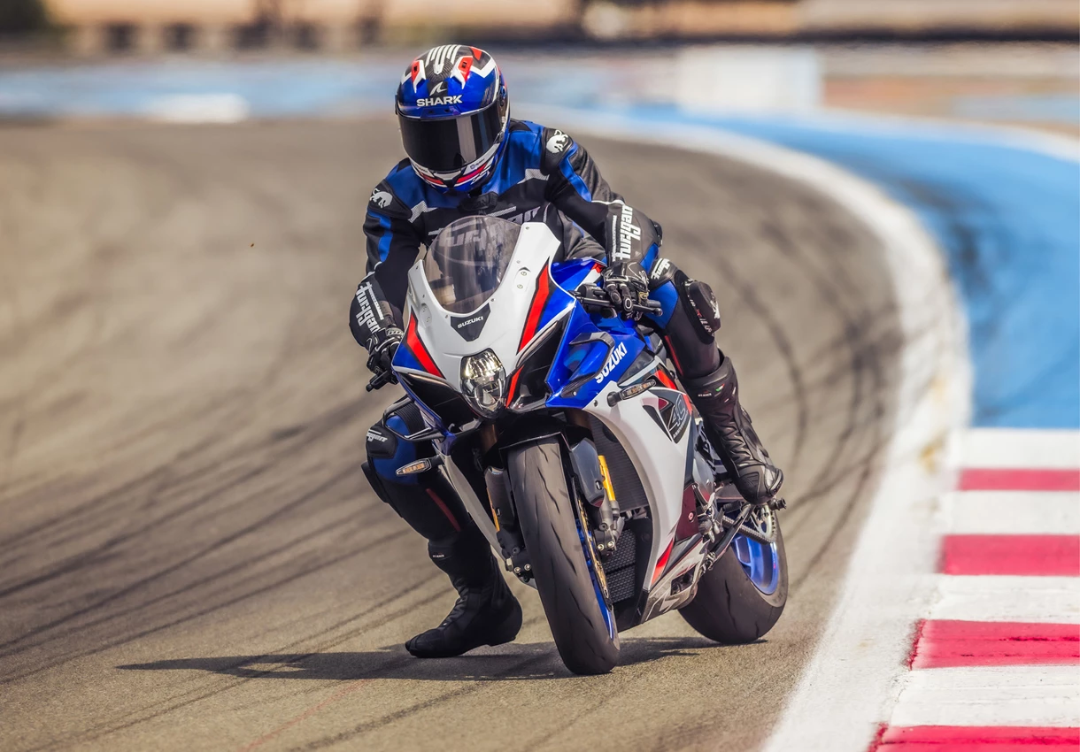 Suzuki GSX-R1000R braking hard into a corner with the rear end backing in.