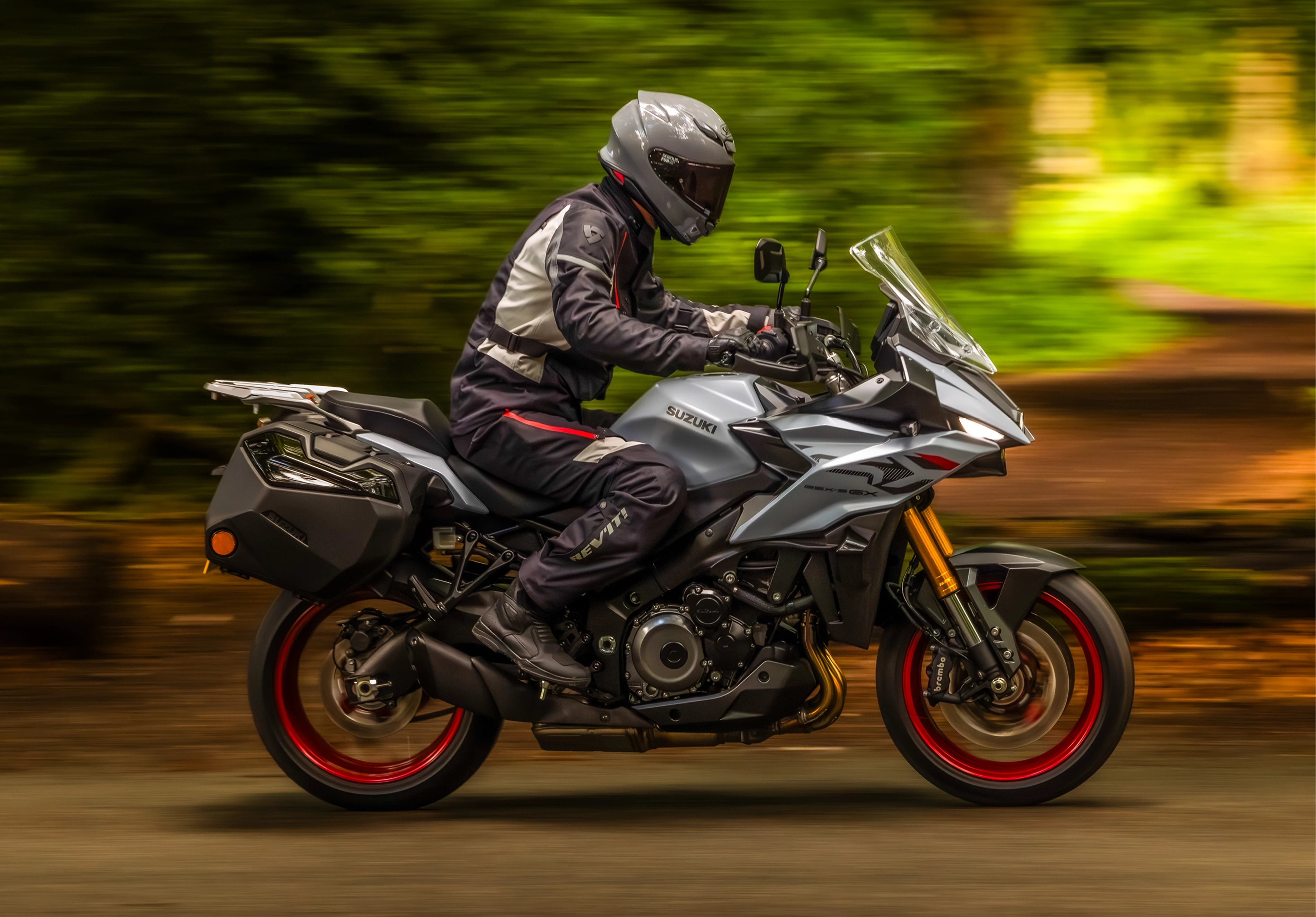 Suzuki GSX-S1000GX+ on a tree lined load