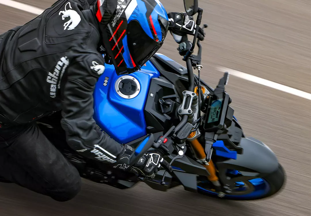 Suzuki GSX-S1000 overhead shot, whilst turning into a corner.