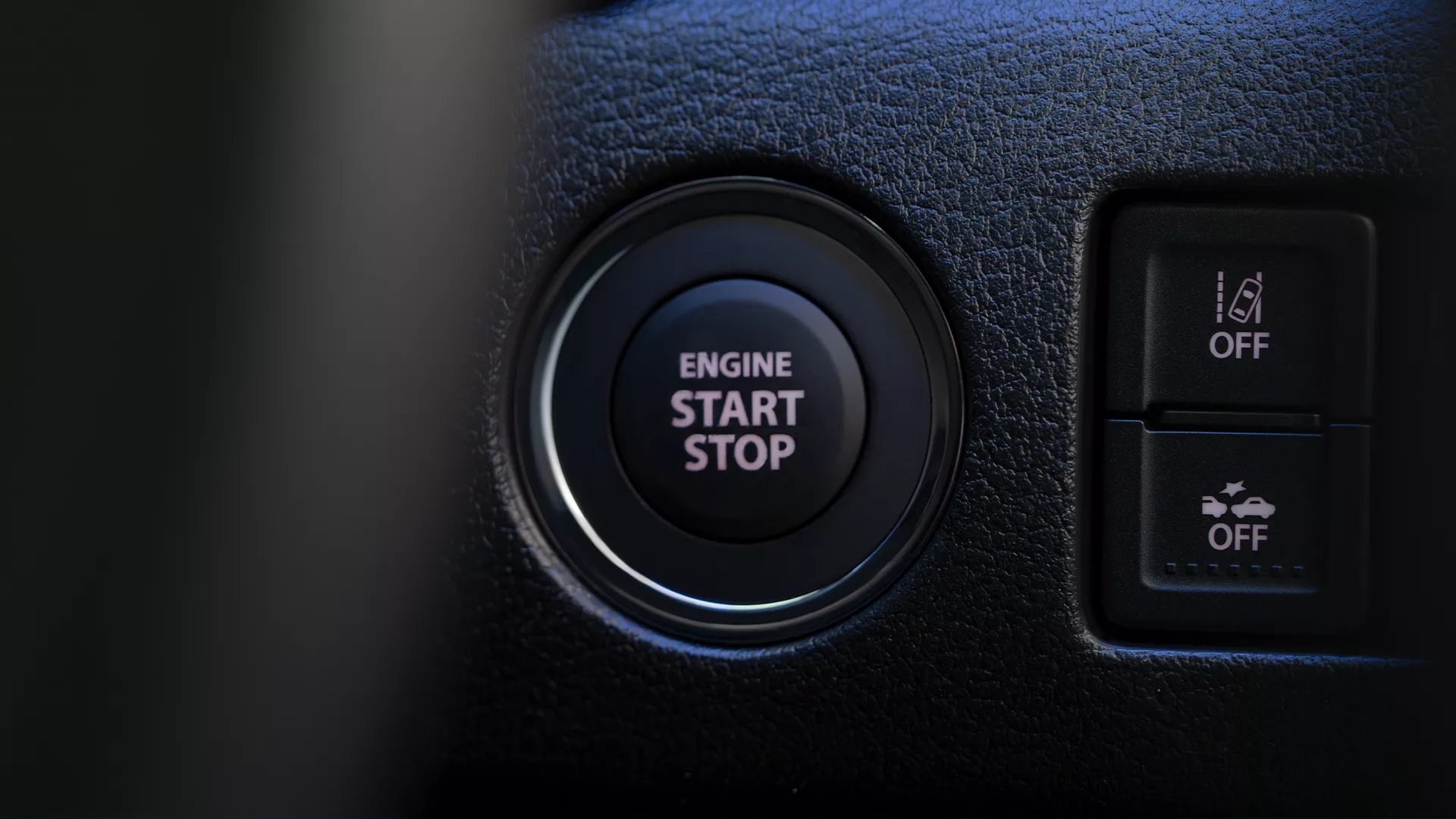 Suzuki e Vitara keyless entry system with illuminated engine start/stop button and advanced driver assist toggle switches