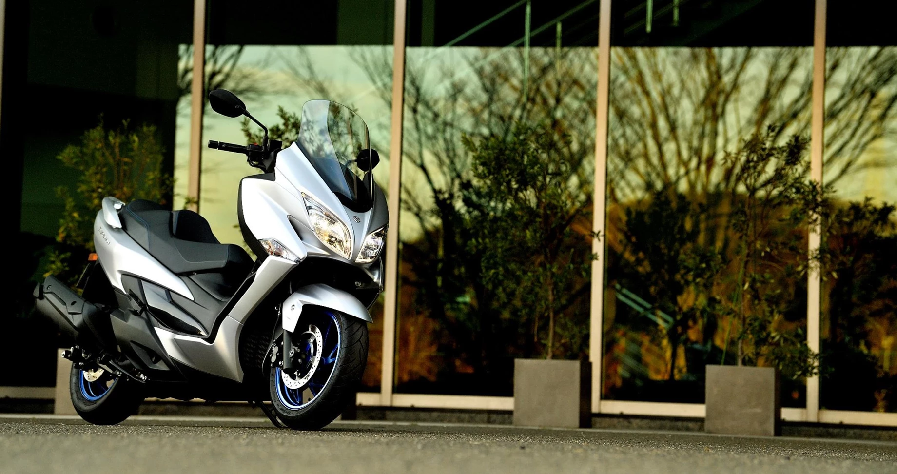 Suzuki Scooter riding through urban environment