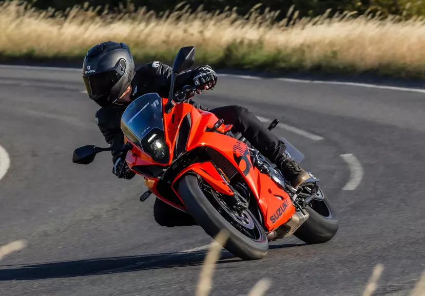 Suzuki GSX-8R leaning into a corner on a country road