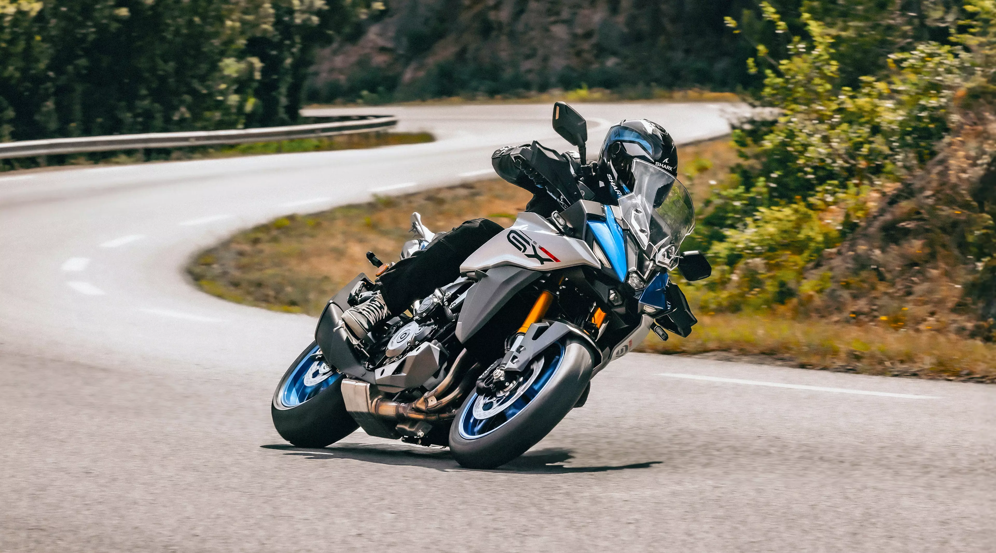 Suzuki GSX-S1000GX on a country road.