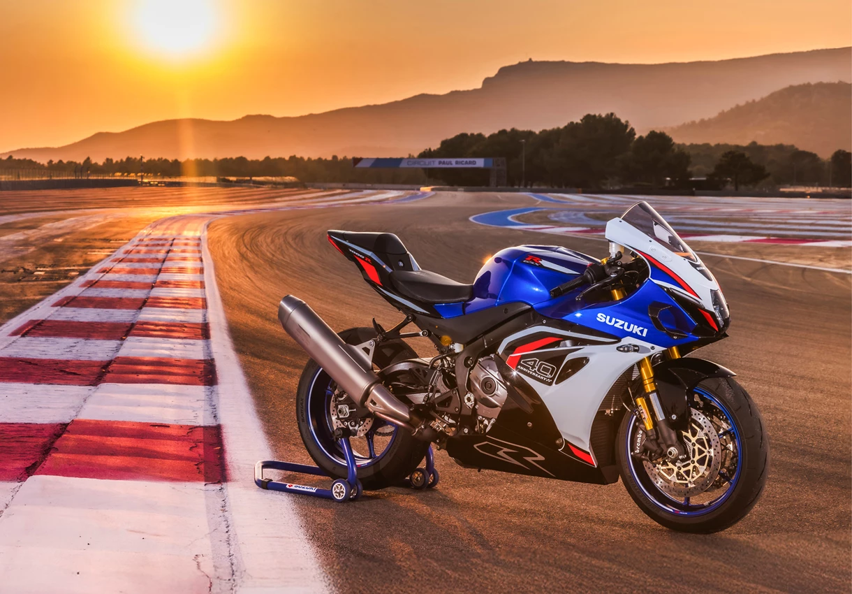 Suzuki GSX-R1000R static on track with a sunset background