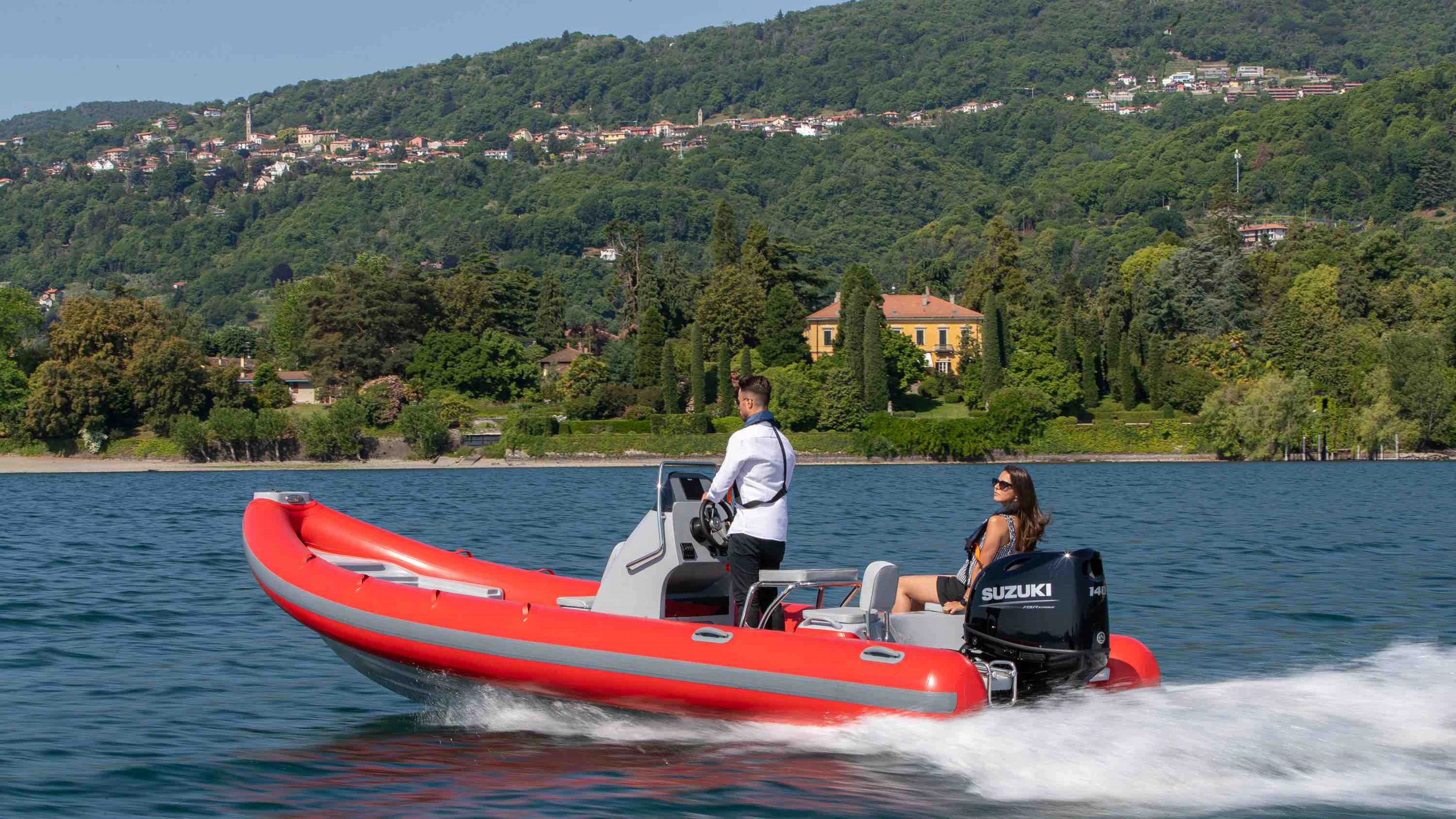 Driving a RIB on a lake with passenger
