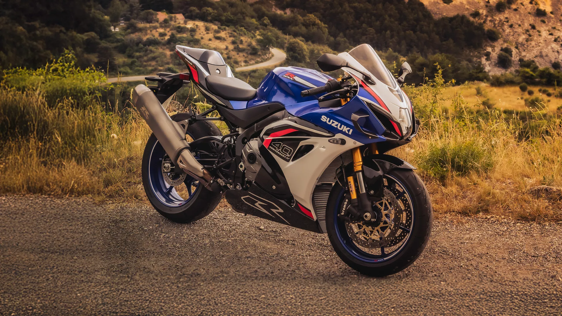 Suzuki GSX-R1000R blue, right hand side static with a mountain background