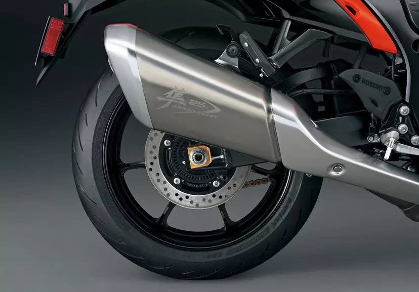 Right-side view of the Suzuki Hayabusa’s exhaust pipe featuring the engraved 25th Anniversary logo, highlighting the commemorative edition.