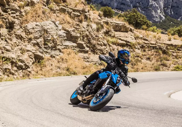 Suzuki GSX-8S leaning into a corner on a mountain road