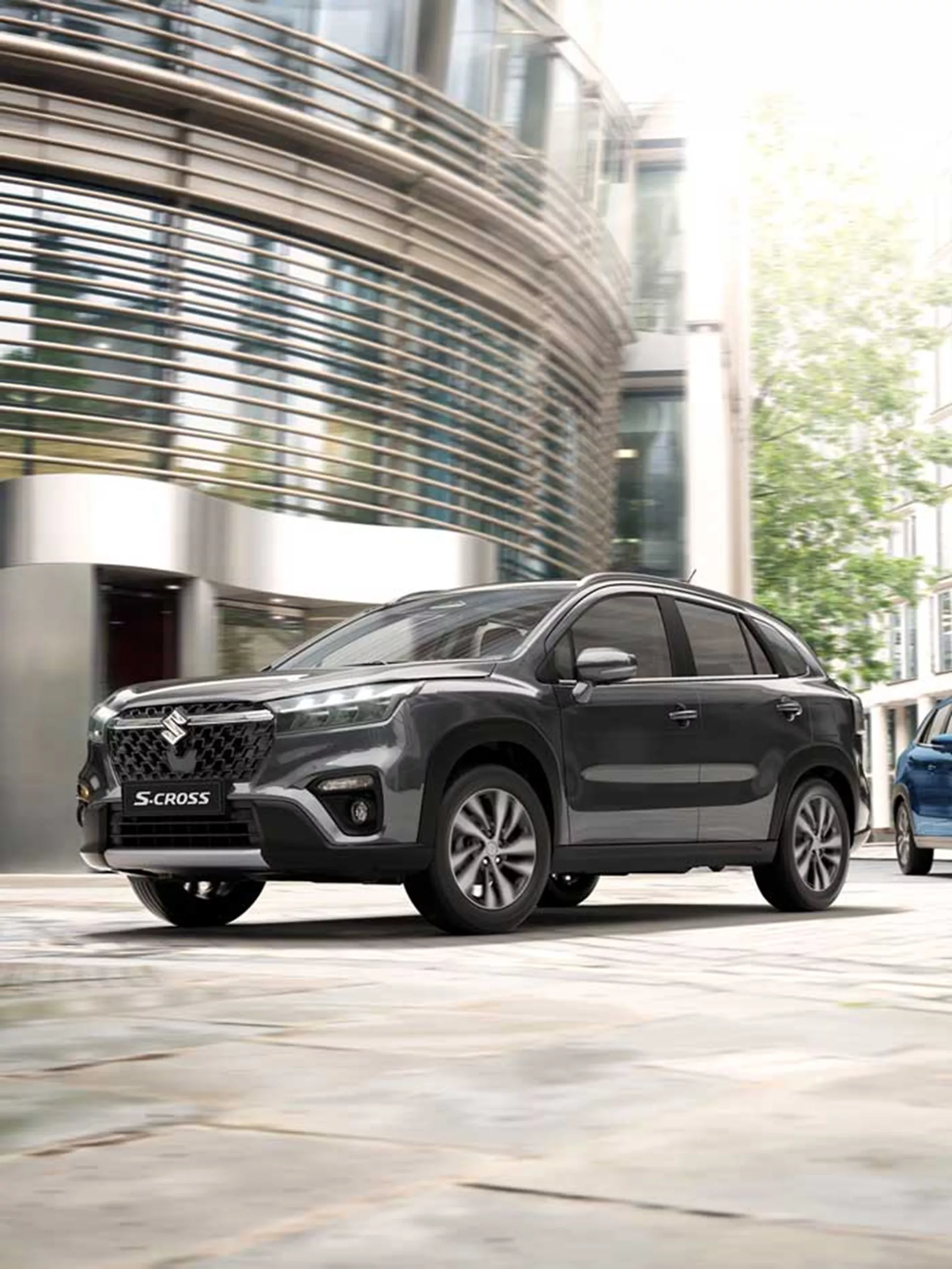 Suzuki S-Cross hybrid SUV parked in an urban setting.