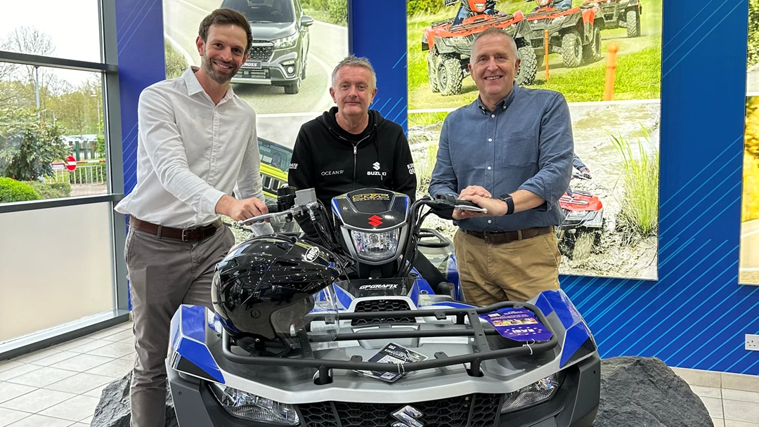 James Tonks, Harvey Day and Mark Beeley beside a limited edition ATV