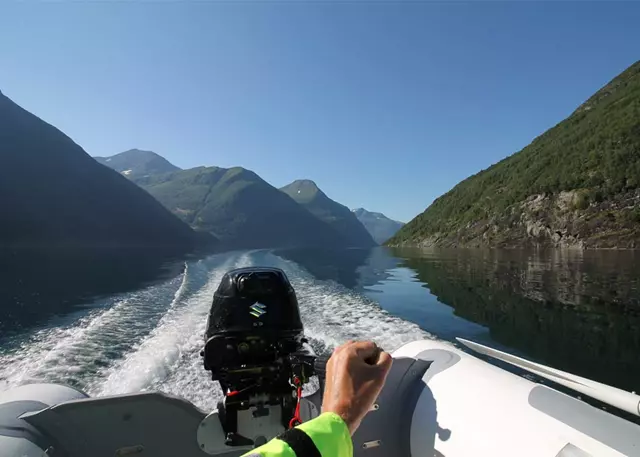 A Suzuki outboard powering a boat on a lake