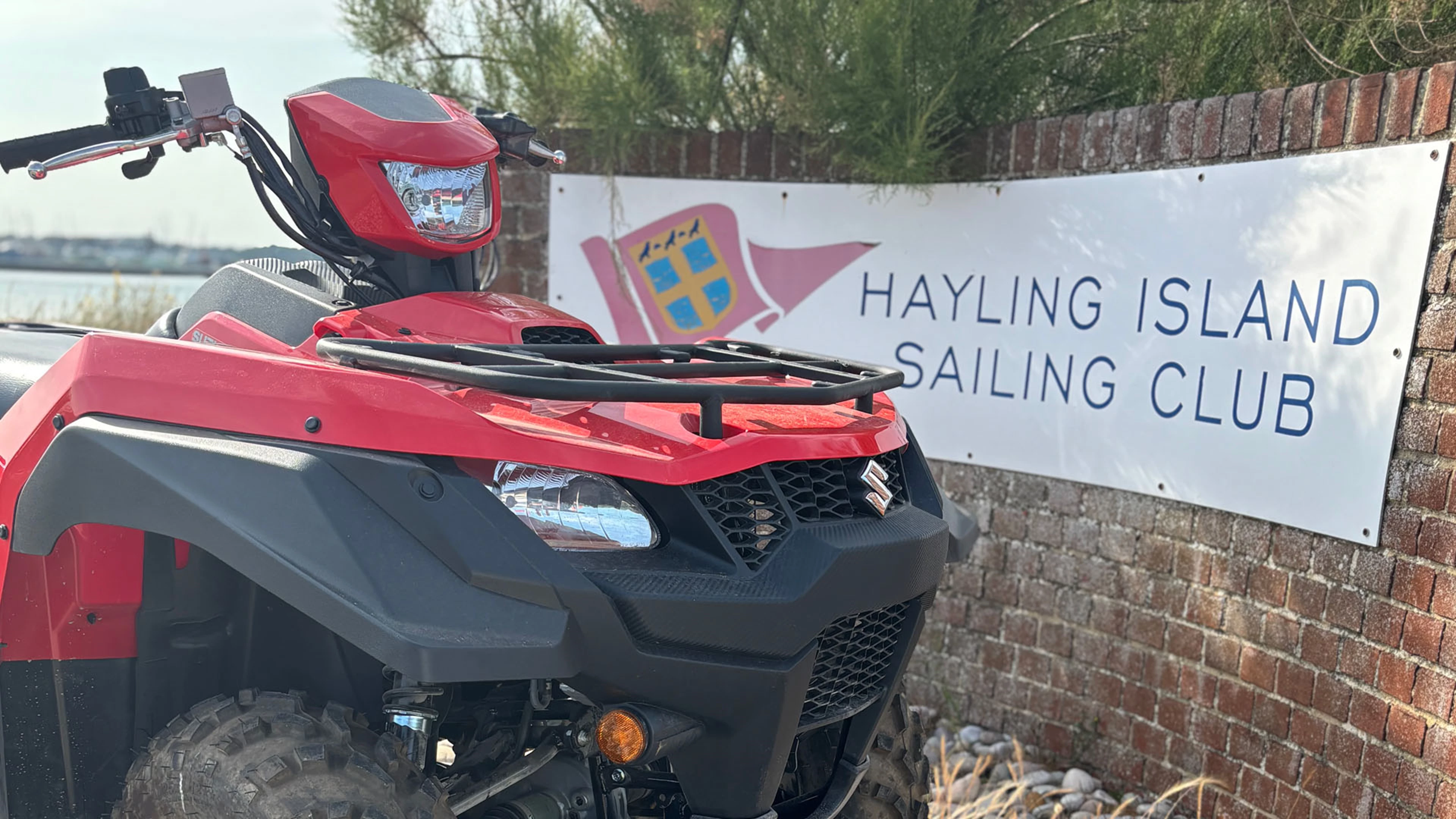 Suzuki KingQuad next to Hayling Island Sailing Club sign