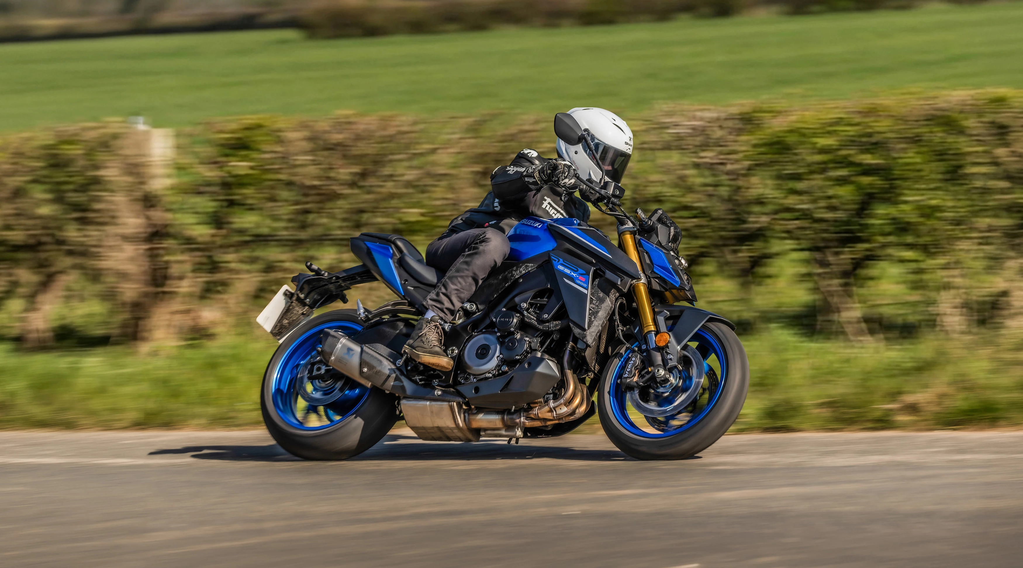 Suzuki GSX-S1000 in action on a country road.