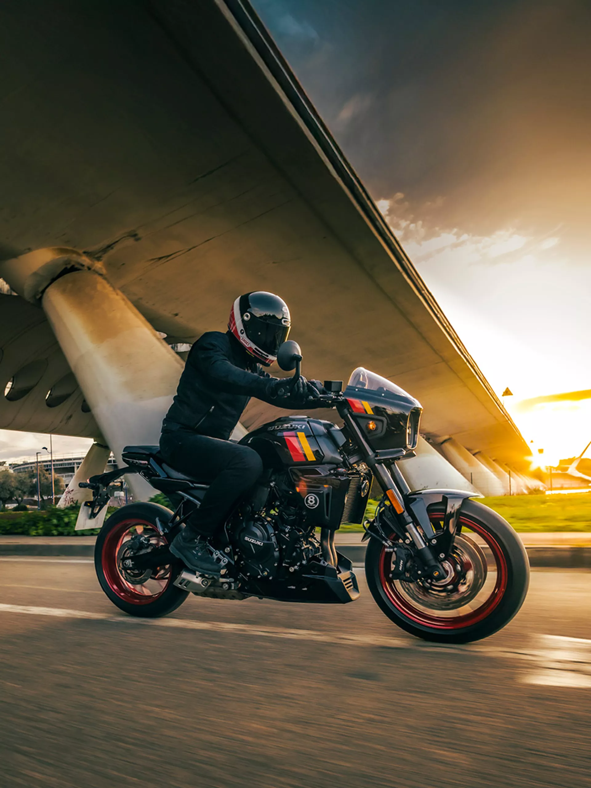 Suzuki GSX-8TT black riding through an urban environment