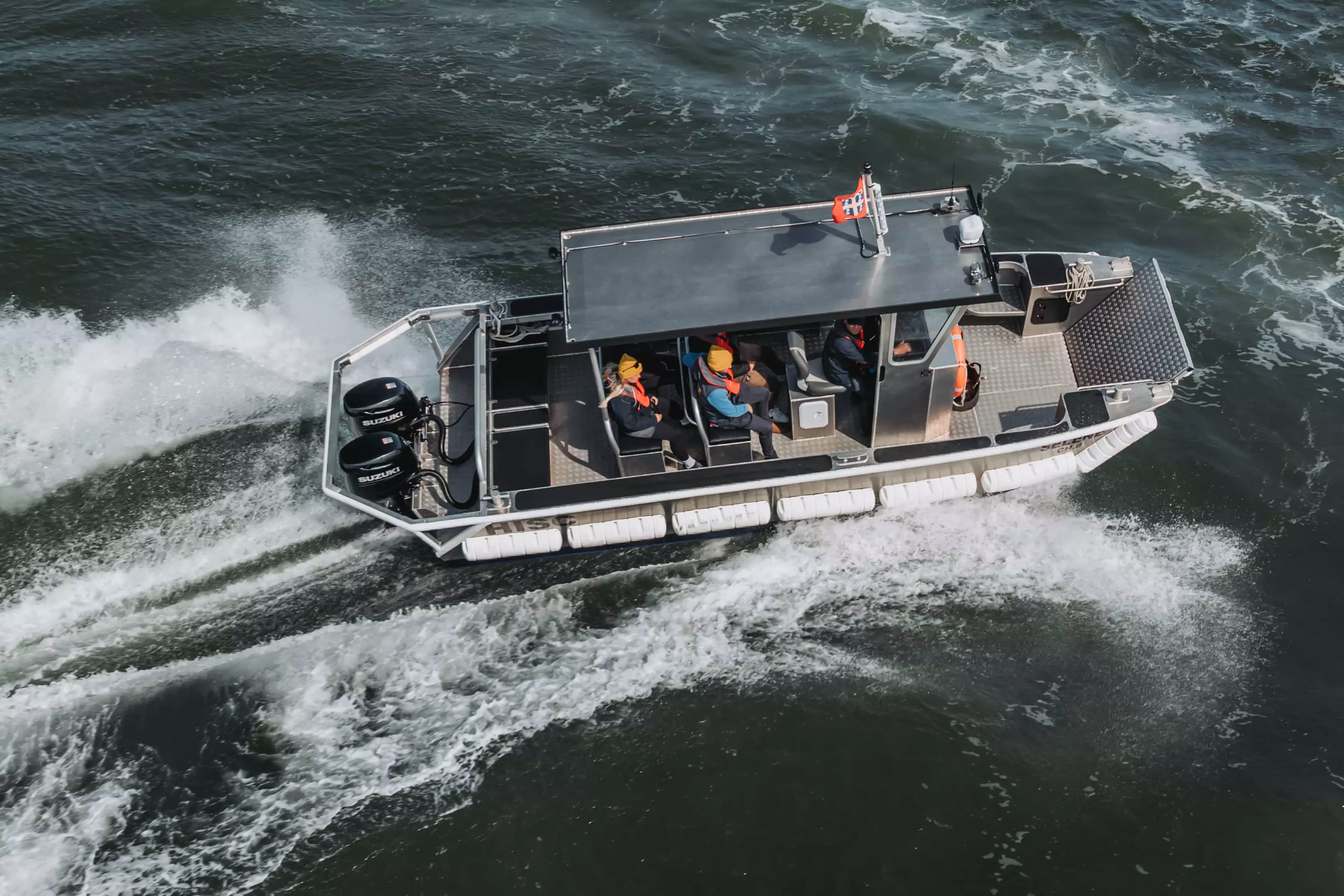 Robust Boat powered by twin Suzuki outboards