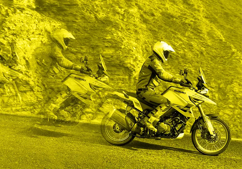 Suzuki V-Strom 1050DE motion blur heading down a hill