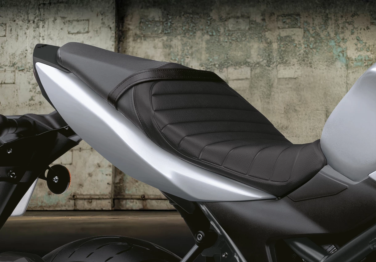 Suzuki SV650X Tuck and Roll Seat with hanger door in the background