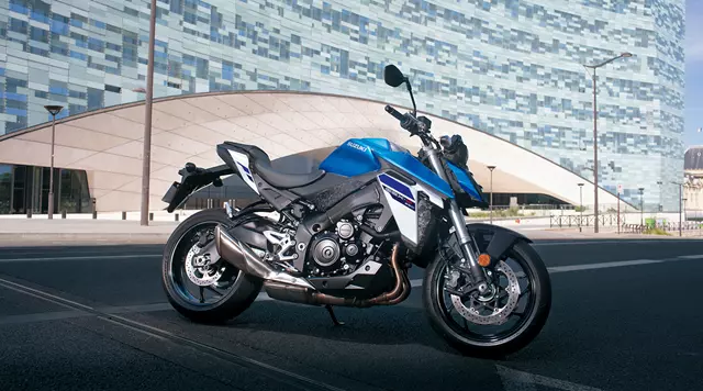 Suzuki GSX-S950 static with a large modern building behind