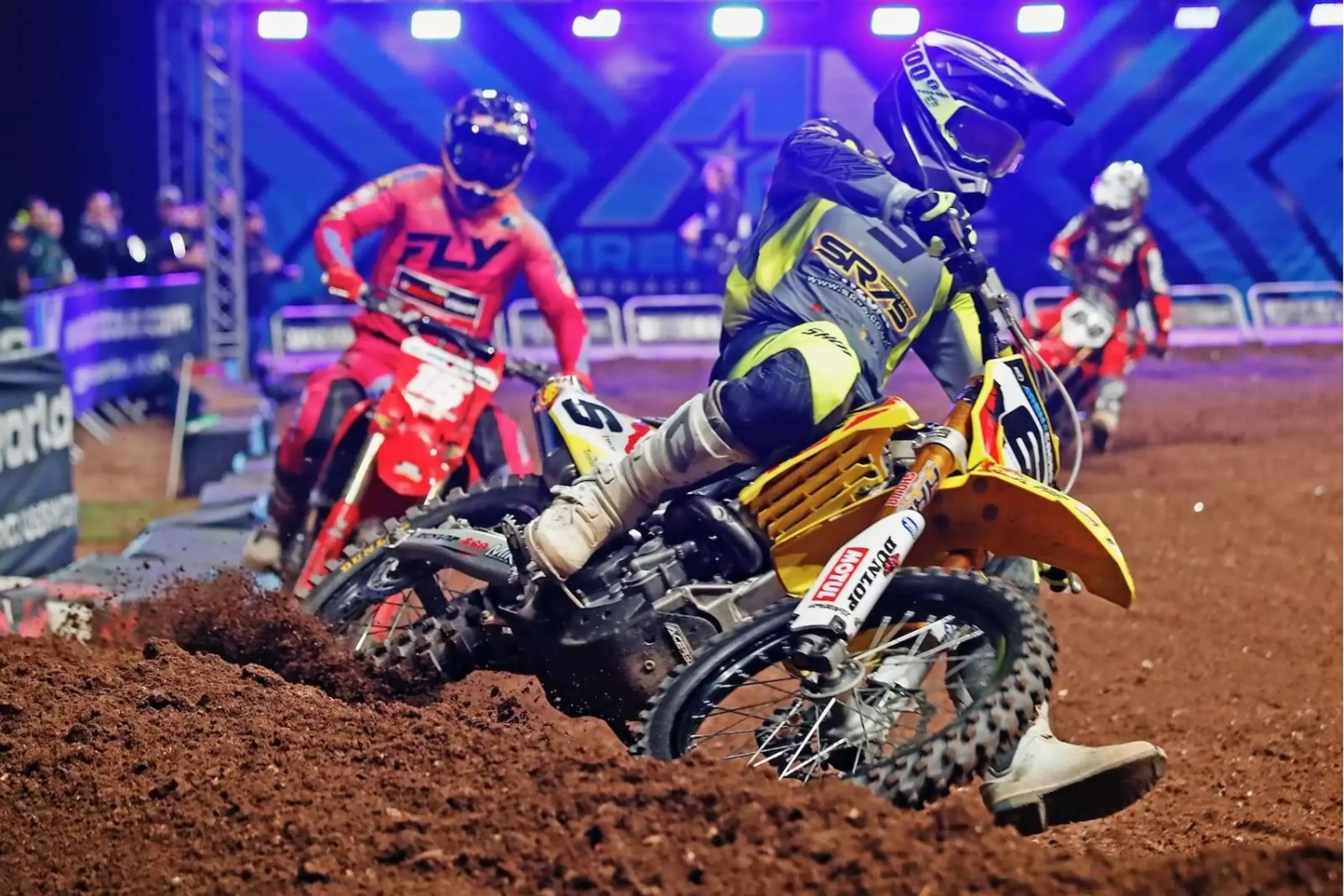 A yellow Suzuki RM-Z450 racing in the Arenacross Championship