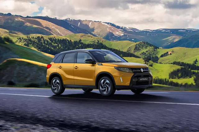 Suzuki Vitara yellow driving through mountains