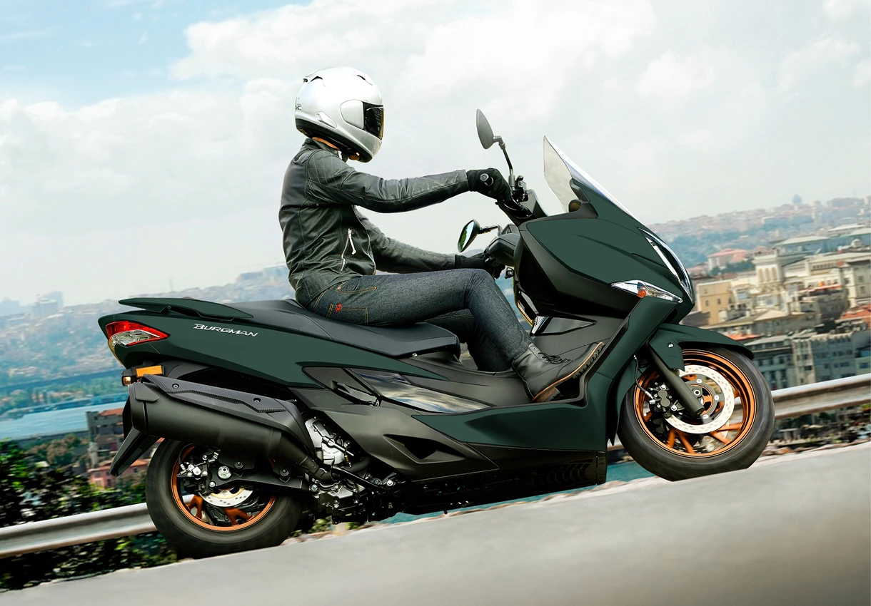 Suzuki Burgman 400 right hand side image on the outskirts of the city. 