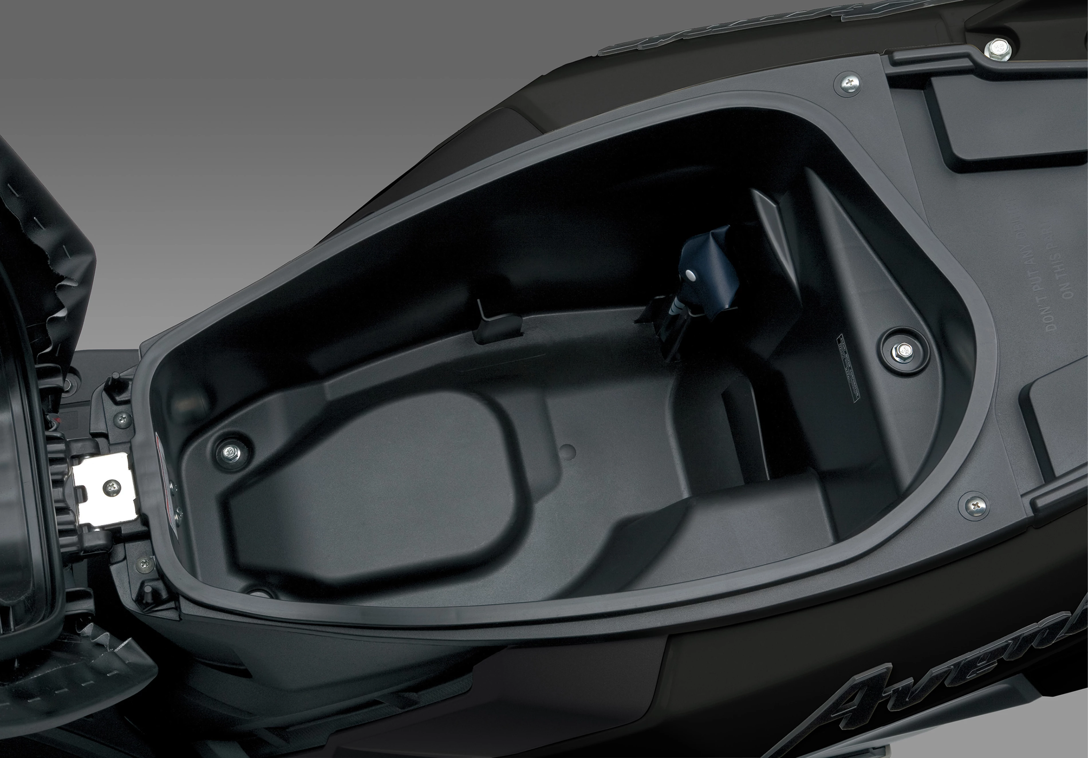 Suzuki Avenis 125 spacious under-seat storage compartment, showcasing its practicality for everyday use.