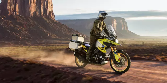 Suzuki V-Strom 1050DE Tour riding along a dirt desert track