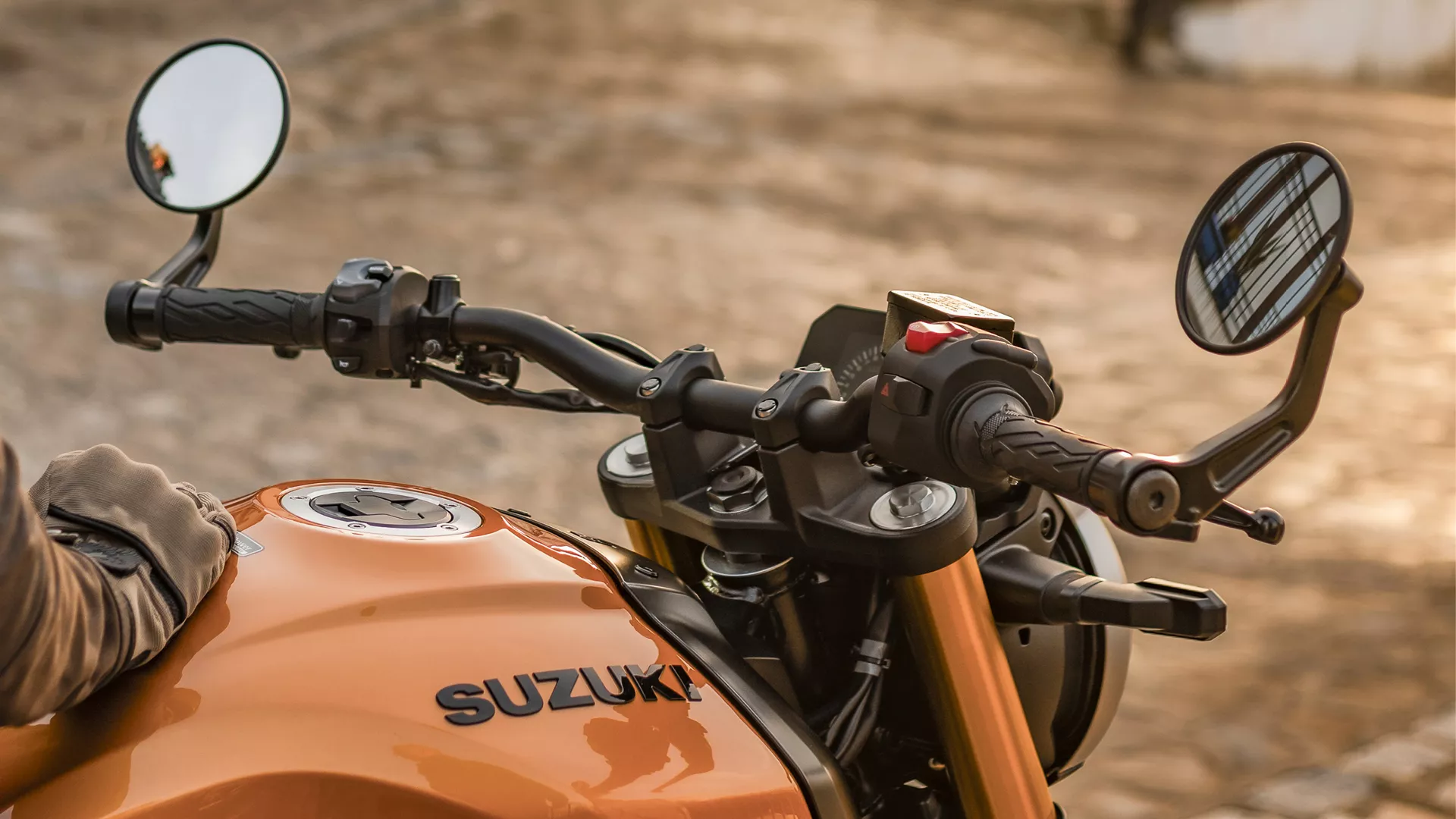 Suzuki GSX-8T fuel tank, bars and bar end mirrors close up.