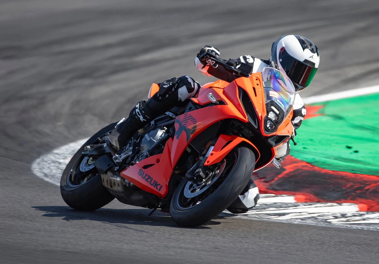 Suzuki GSX-8R leaning hard into a corner out on track