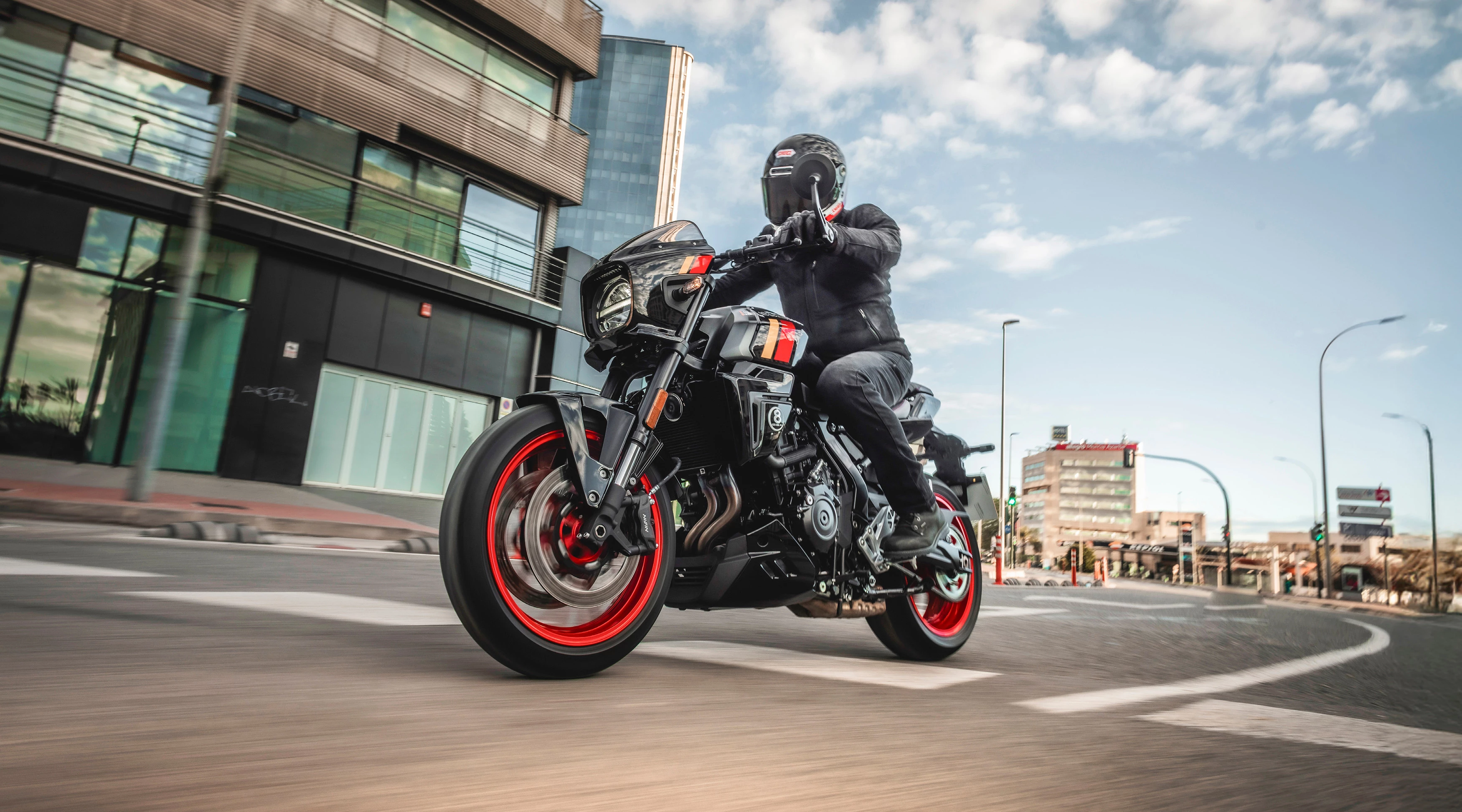 Suzuki GSX-8TT riding purposefully through the city. 