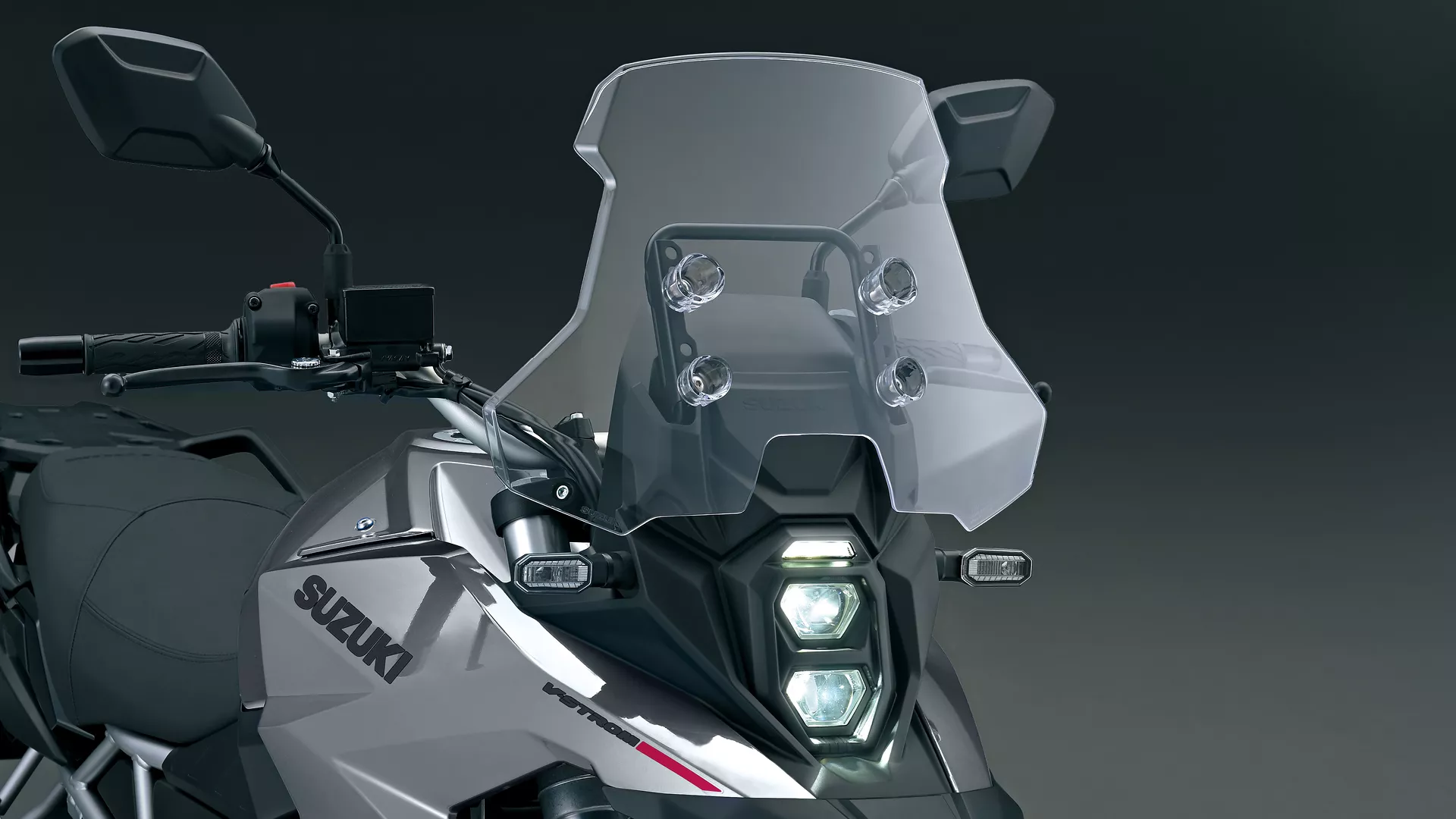 Suzuki V-Strom 800RE front on, showcasing the screen and headlight