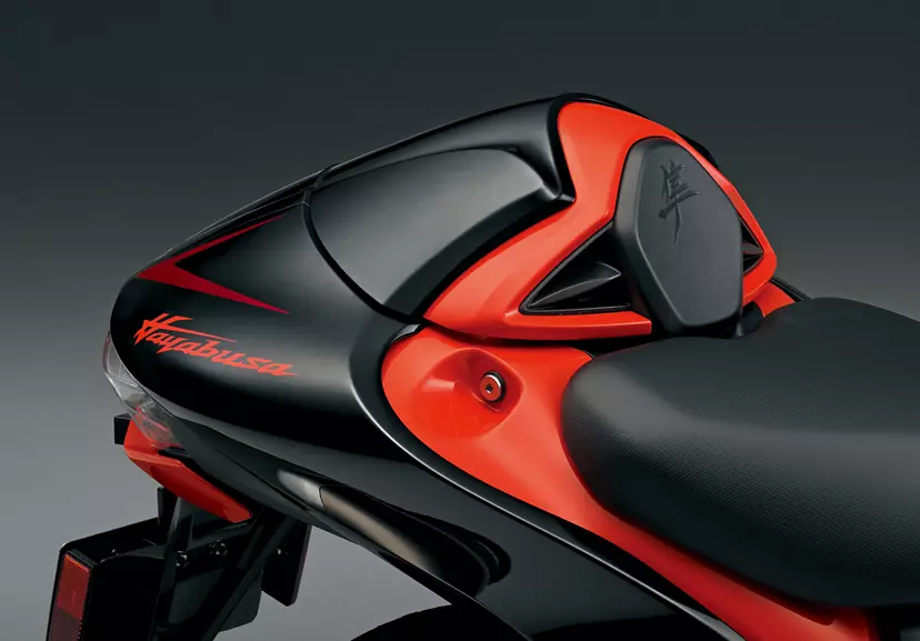 Suzuki Hayabusa motorcycle rear seat cowl in black and orange with Hayabusa branding.