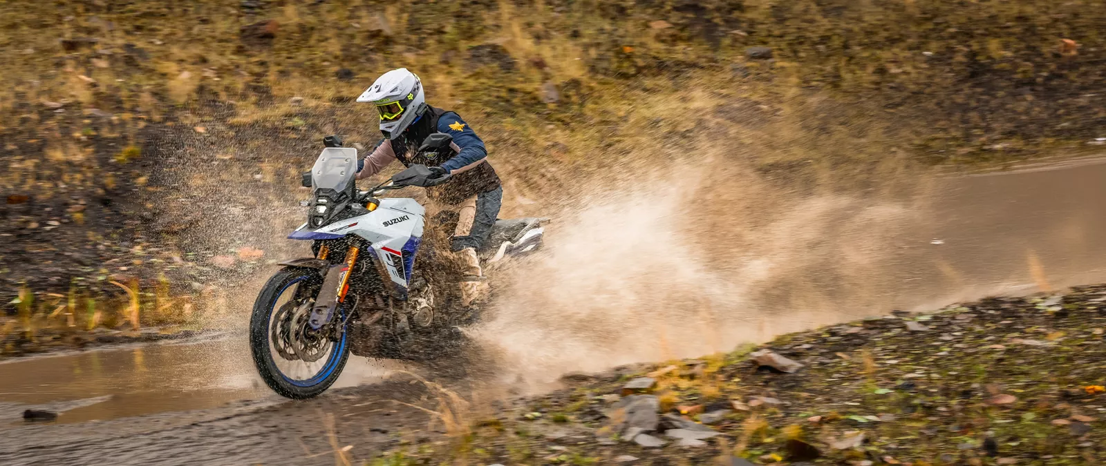 Suzuki V-Strom 800DE pushing on through a water splash