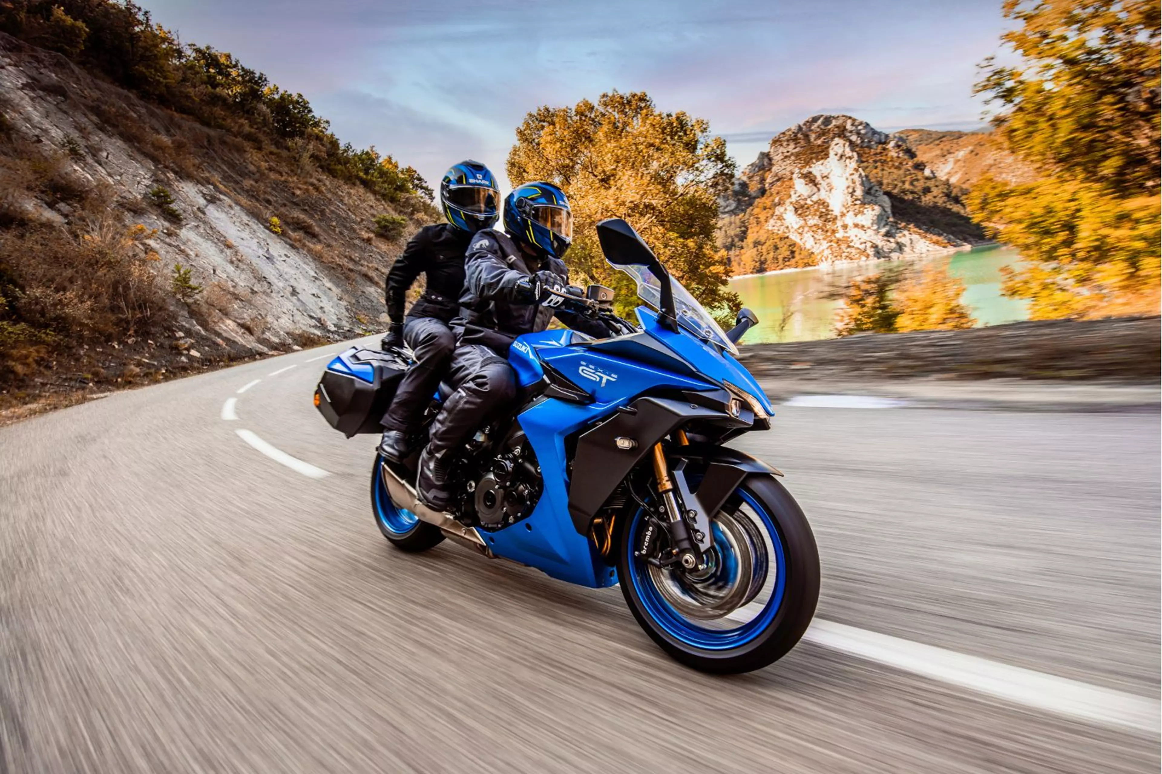 Blue Suzuki GSX-S1000 GT with a pillion