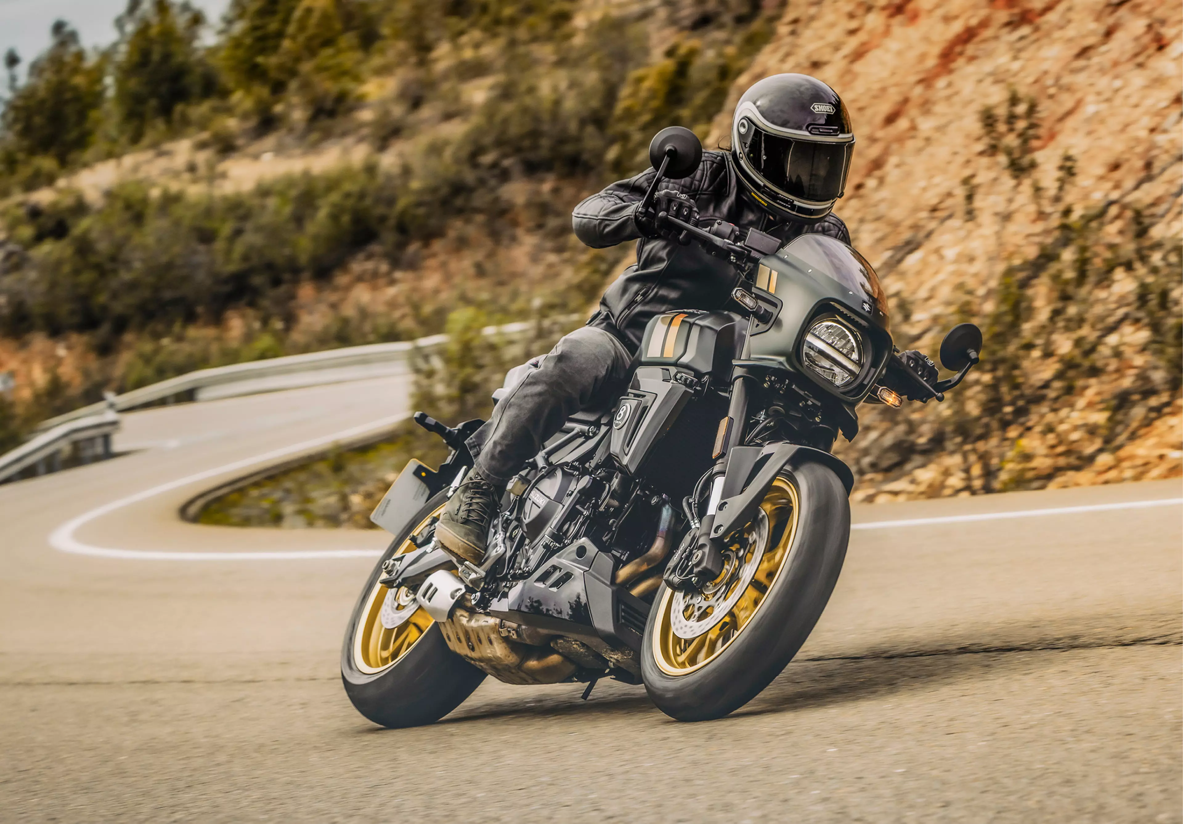 Suzuki GSX-8TT pushing hard round a corner on a mountain pass.