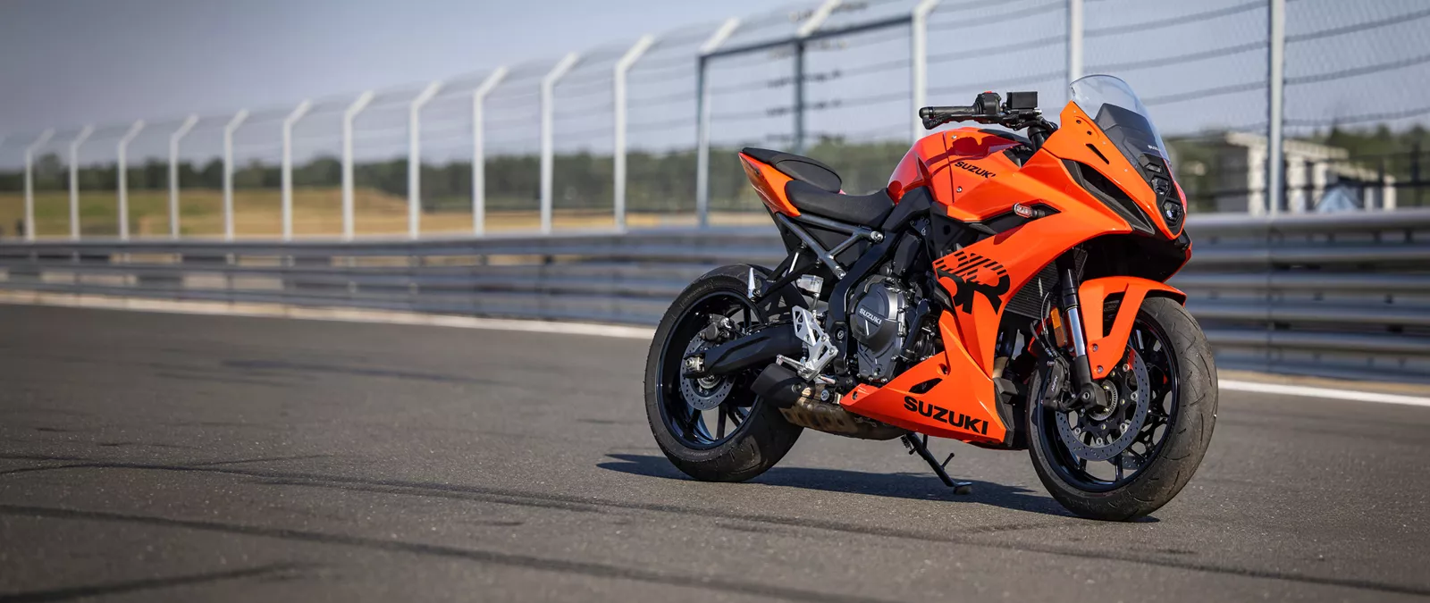 Suzuki GSX-8R orange right hand side static in a pit lane