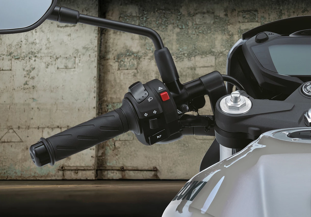 Suzuki SV650X Clip on Handlebars with hanger door in the background