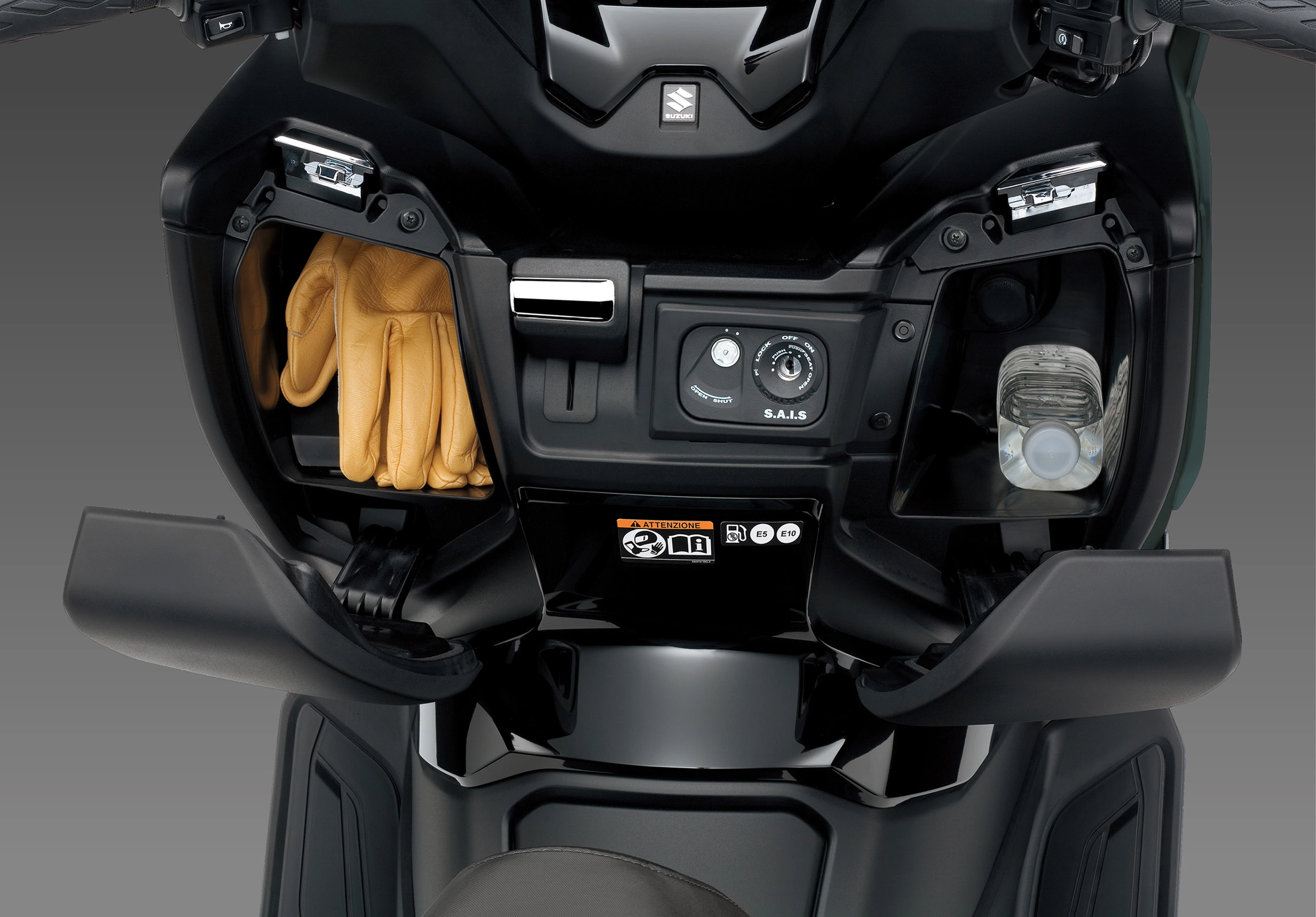 Suzuki Burgman 400 front storage areas opened with gloves in one side. 