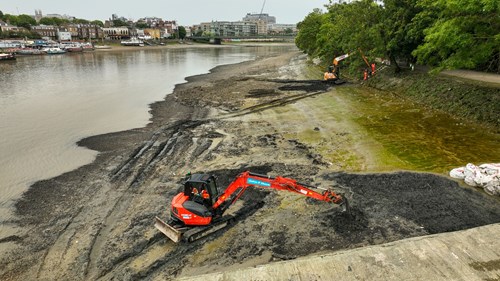 Diggers working at Wet Wipe Island near Hammersmith Bridge in London