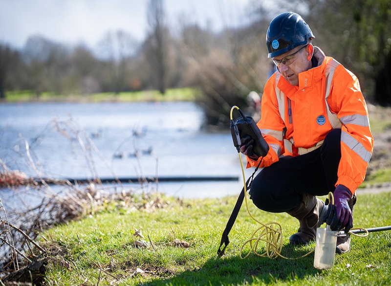 A Thames Water Engineer Taking Water Samples From The River